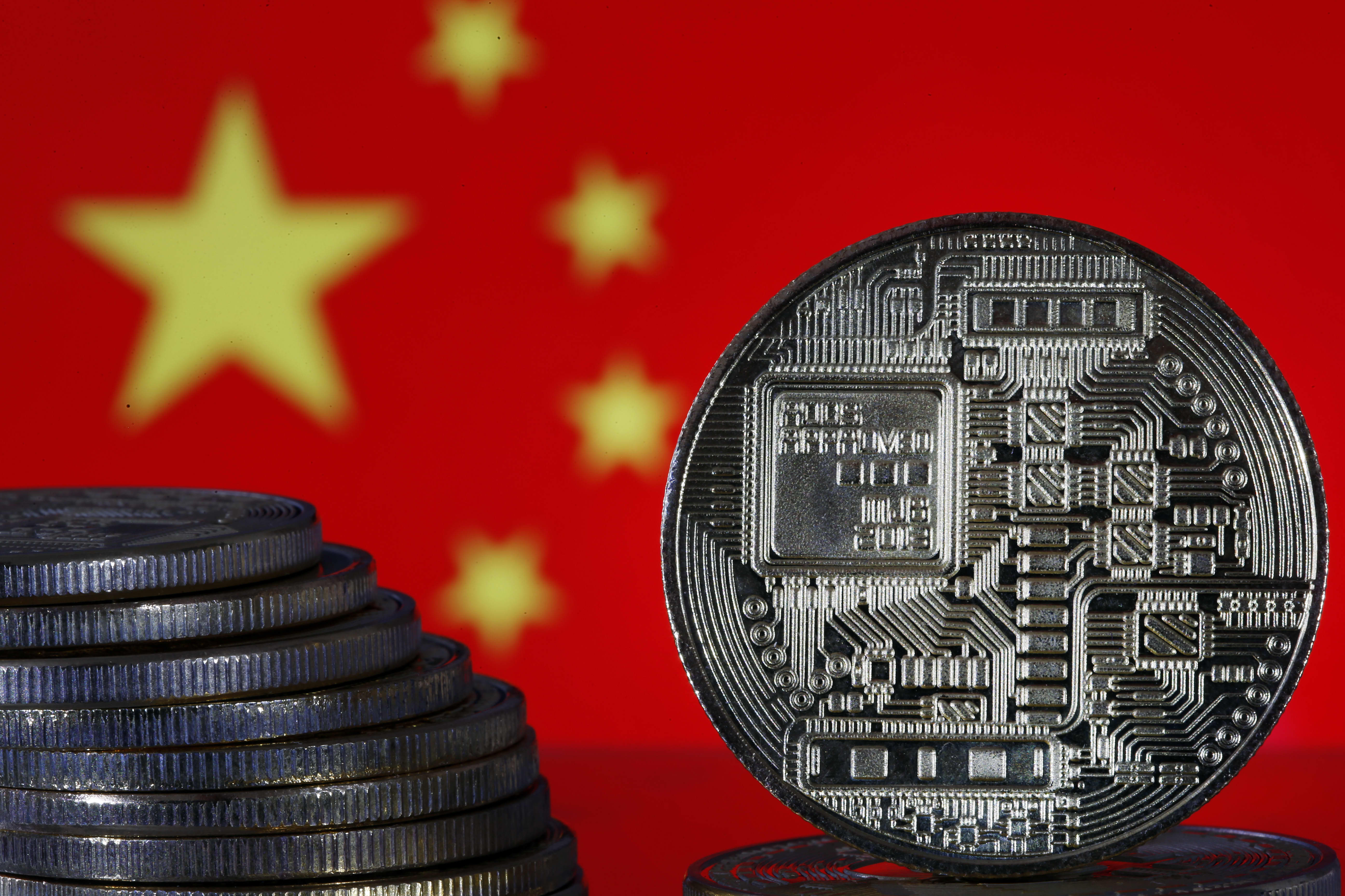 Chinese digital currency stocks surge amid new efforts to promote e-CNY | Reuters