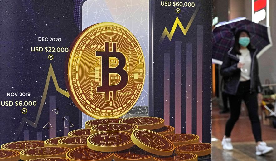 Bitcoin briefly tops $70K as crypto mania sparks another record high